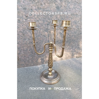  Подсвечник на три свечи. Бронза. Высота: 32 см.
